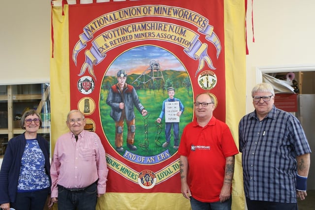 Nottinghamshire Mining Museum is located at Mansfield Railway Station and contains items, artefacts, documents, and history from across the Nottinghamshire coalfields. For updates on events and opening times, see www.facebook.com/NottsMining (Pictured: Museum volunteers Ann and Barry Donlan, David Whitchurch and Dennis Burgin with the NUM Ex and Retired Mineworkers Banner).
