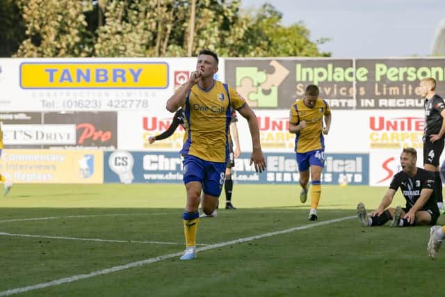Mansfield Town midfielder Ollie Clarke has departed the club for Swindon Town.