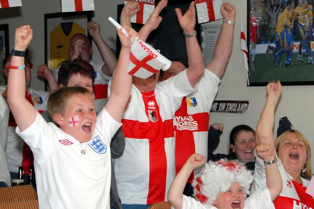 Fans cheer an England goal.
