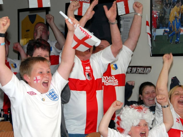 Fans cheer an England goal.