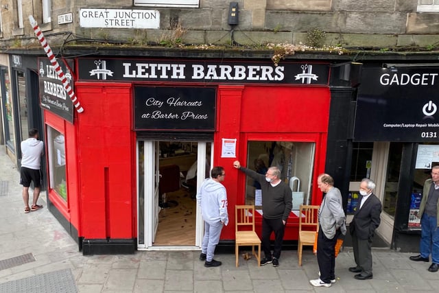 In Leith, people waited in a socially distanced queue outside as they waited on a haircut