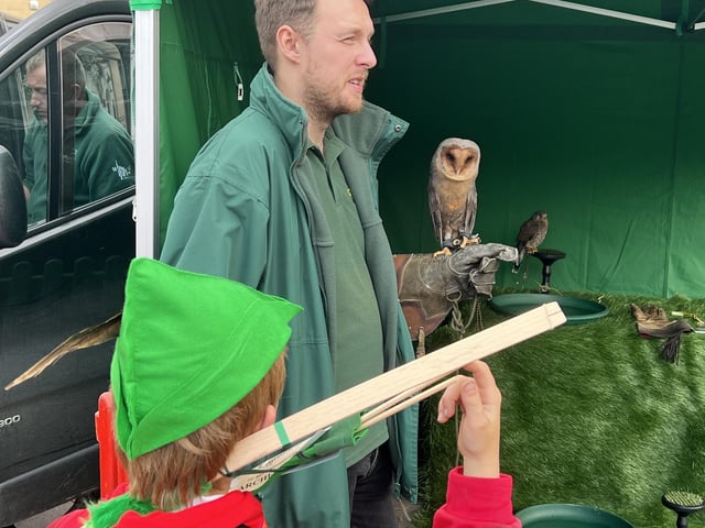 Falconry was a popular feature, especially for this young Robin Hood in the crowd.