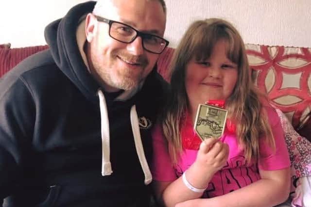 Lee and Jessica after his first Marathon in 2019
