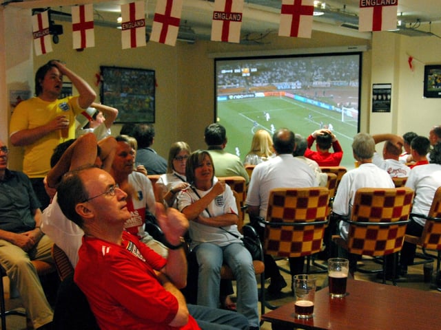 Mansfield Town staff and fans watch England v USA.