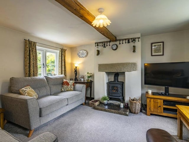 The living room is just as delightful as the dining room, especially with its fireplace and log-burner. It's the perfect spot to unwind, particularly on chilly winter evenings.