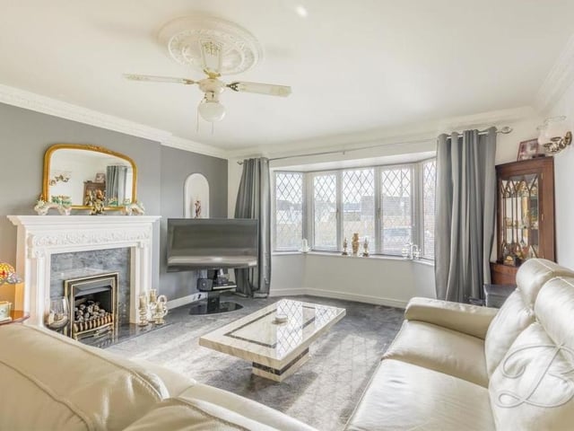 The perfect place to start our tour of the bungalow is this open-plan lounge diner. Note the feature fireplace and the brilliant bay window, which allows a wealth of natural light through.