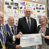 Broxtowe Lodge presenting a cheque to Maria Williams, Reach Mansfield Manager