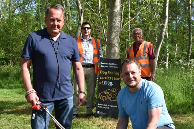 Coun David Martin, Coun Jason Zadrozny and council officers at the dog poo tree in Huthwaite's Brierley Forest Park.