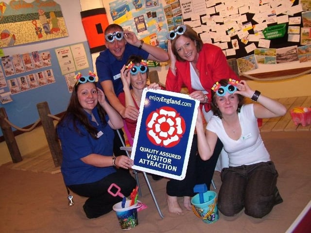Staff from Mansfield Museum celebrated securing status as a Quality Assured Visitor Attraction, along with portfolio holder for regeneration Coun Kate Allsop.