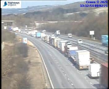 Traffic cameras are showing long tailbacks at the scene.
