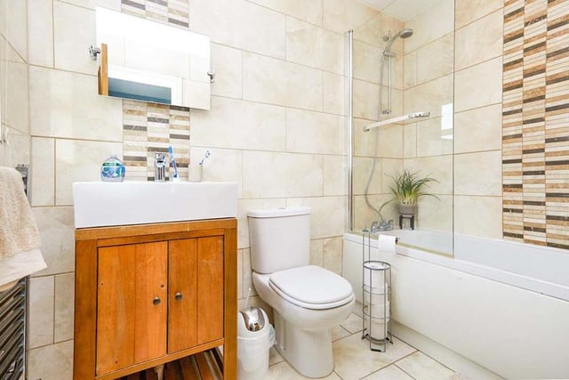 The family bathroom can also be found on the first floor. Recently upgraded and well presented, it is a modern room consisting of a panelled bath with shower over, a modern vanity unit with inset sink and a low-flush WC. The walls and floor are tiled.