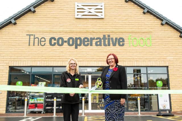 Co-op Warsop Store Manager Natalie Smith and Elaine Hopkins MBE cut the ribbon on the brand new store