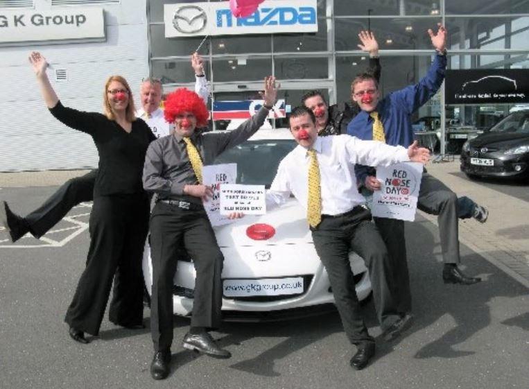 Staff at a Mansfield car dealership getting into the Red Nose Day mood back in 2009