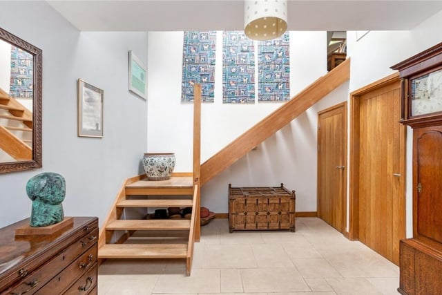 The tiled entrance hall displays an open staircase and provides access to a ground-floor shower room and cloaks cupboard. Also off the entrance hall sits the kitchen and lounge diner.