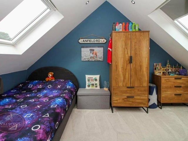 Two uPVC double-glazed skylights at the front and back add brightness, and drama, to this bedroom on the first floor. There is also eaves storage and a vertical radiator.