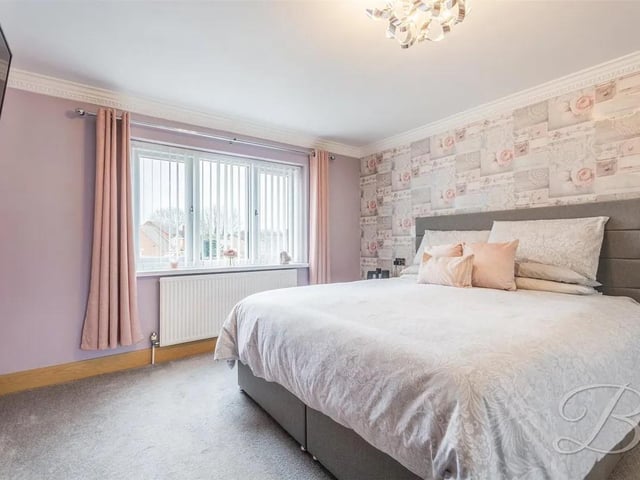 One of four spacious bedrooms in the family home