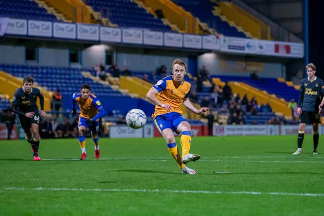 Danny Johnson  scores from the penalty spot during the Papa John's Trophy match against Newcastle U21s at the One Call Stadium last mnight. Photo by Chris HOLLOWAY/The Bigger Picture.media
