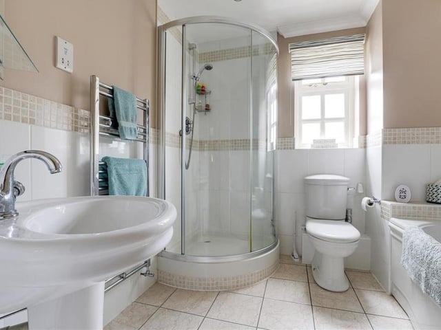 The family bathroom, which can be found on the first floor, consists of a delightful four-piece suite. Feast your eyes on a panelled bath, a corner fitted shower enclosure with mains-fed shower, low-flush WC and pedestal wash basin. And don't miss the chrome heated towel-rail, recessed spotlights and tiled flooring.