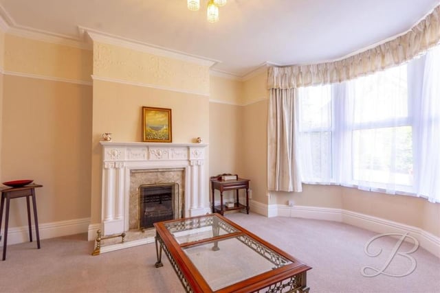 Bask in the elegance of the living room at the £250,000-plus property. Its appearance is enhanced by a feature fireplace with attractive surround, and a lavish, double-glazed bay window, allowing a wealth of light to flow through the room.