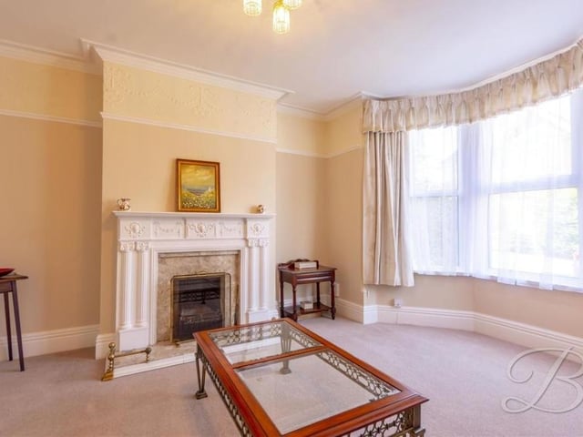 Bask in the elegance of the living room at the £250,000-plus property. Its appearance is enhanced by a feature fireplace with attractive surround, and a lavish, double-glazed bay window, allowing a wealth of light to flow through the room.
