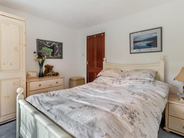 This bedroom has ample space for wardrobes and other storage furniture.