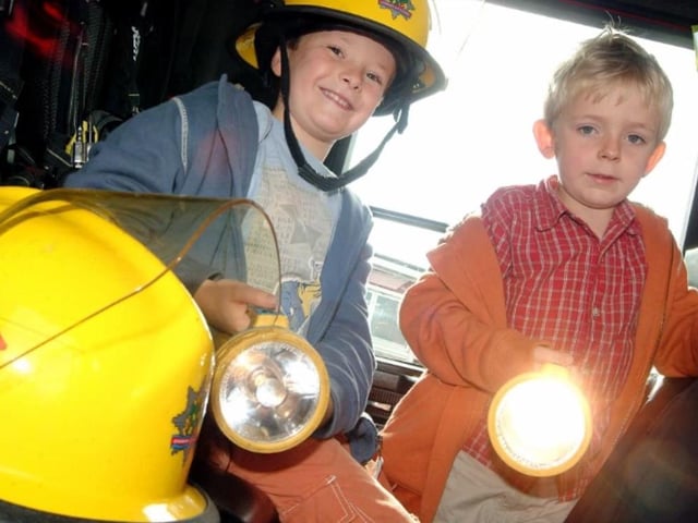 Brothers Ben and Elliot Harrison navigate their way around a visiting fire engine at Mansfield Woodhouse Mardi Gras in 2007.