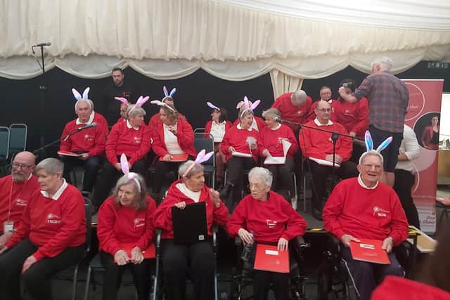 Members of the choir getting ready to perform to a packed house