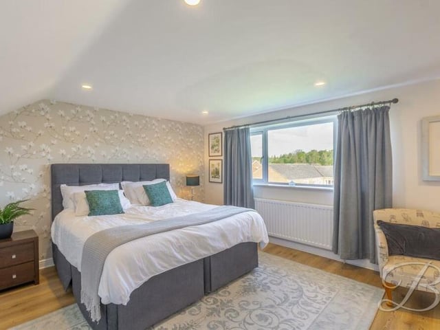 The master bedroom at the £325,000-plus Sutton property sits on the first floor, with a window overlooking the rear garden.