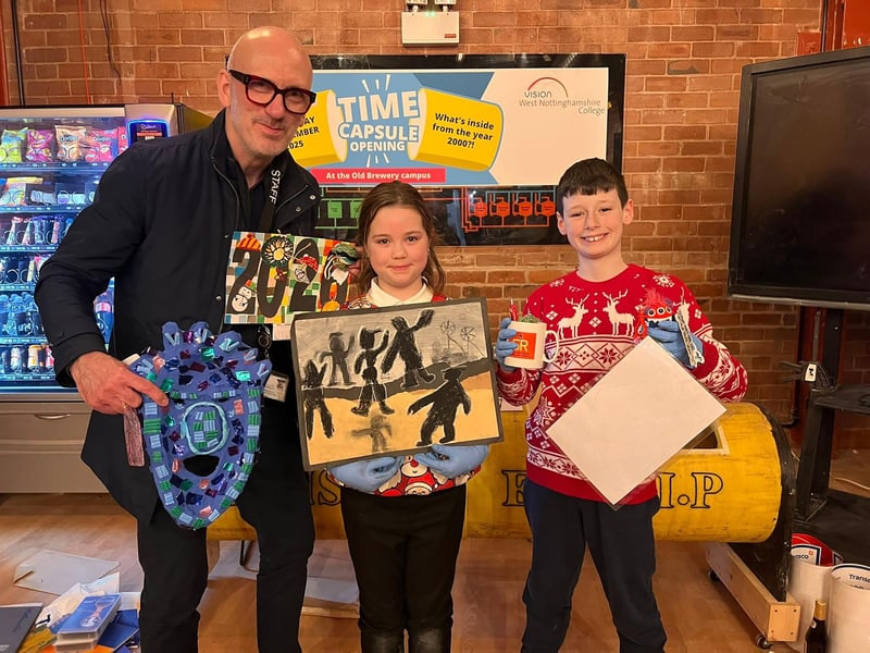 Sutton Road Primary's assistant headteacher Jim Wakeland, Faith and Henry with items they brought in