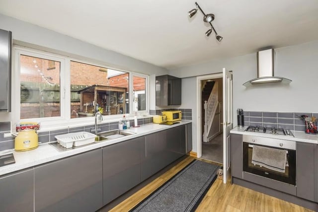 The kitchen is modern, having been recently refitted -- and can't you tell! It is a really appealing room, laced with high-gloss wall and base units, and integrated appliances.