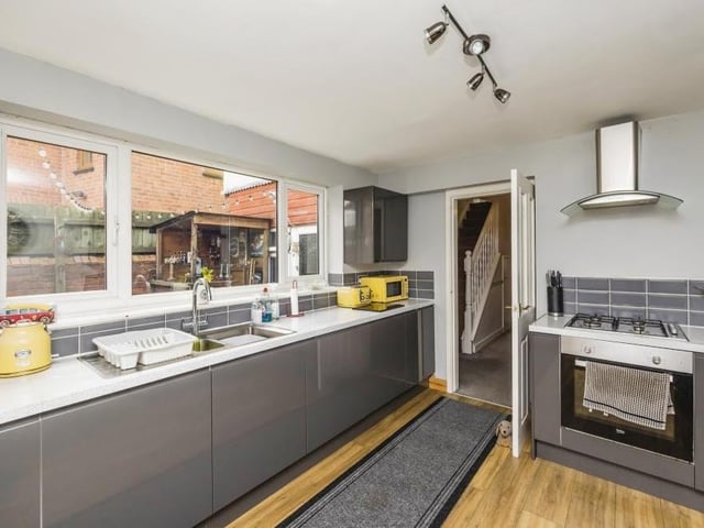 The kitchen is modern, having been recently refitted -- and can't you tell! It is a really appealing room, laced with high-gloss wall and base units, and integrated appliances.