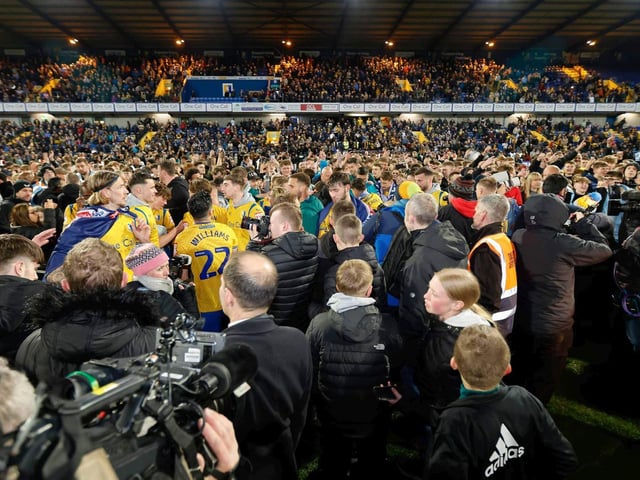 Mansfield Town's fans and players celebrated promotion to League One long into the night.
