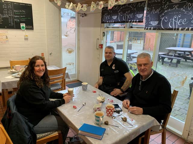 Lee Anderson is pictured with Sam Dakin at Julie’s Café in Eastwood, along with volunteer and fundraiser Neil Tillley.