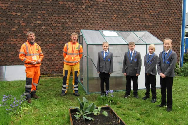 Steve and Steve from NSDC's Street Scene team, with Parkgate pupils in front of the new greenhouse