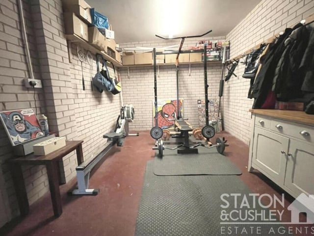 The ground floor also features this good-sized gym, which sits behind the double garage. It is a versatile space that could be converted into a home office or study, if necessary.