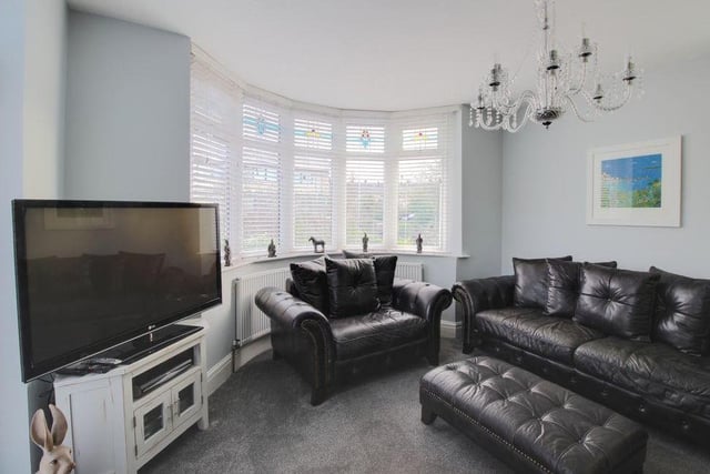 Opposite the kitchen sits this lovely lounge, which is the ideal place to spend a relaxing evening in front of the telly. It has a feature bay window and garden views.