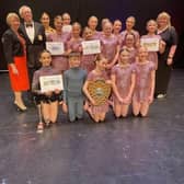 The winners, Excelsior Dance Troupe (aged eight to 18), pictured with the presenters, Paul Bacon, and Katie Trinder from Mansfield 103.2, and the President of Mansfield Rotary, Karen Johnson.