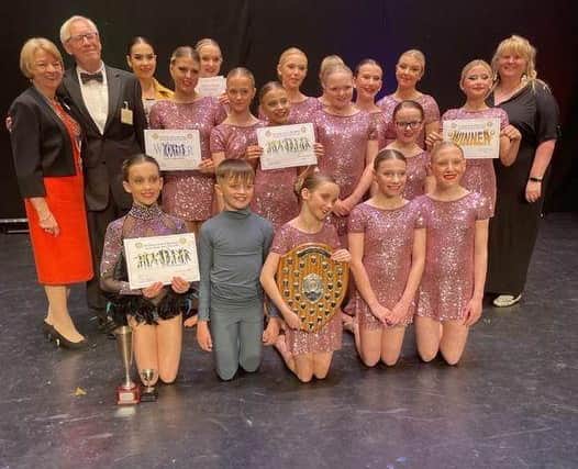 The winners, Excelsior Dance Troupe (aged eight to 18), pictured with the presenters, Paul Bacon, and Katie Trinder from Mansfield 103.2, and the President of Mansfield Rotary, Karen Johnson.