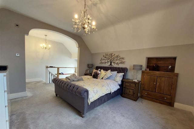 The master bedroom is a delightful hideaway on the top floor of the property.