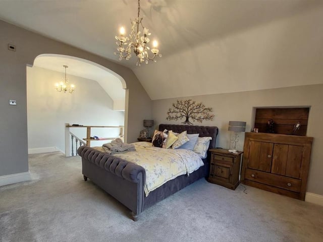 The master bedroom is a delightful hideaway on the top floor of the property.