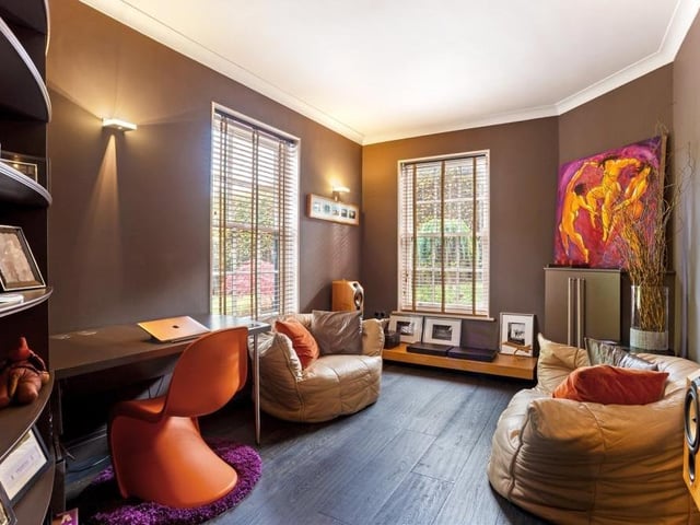 Not many home offices or studies are as relaxing and comfortable as this one. A well-proportioned room, it includes a feature curved wall and shelving, with windows to the rear and side of the property.