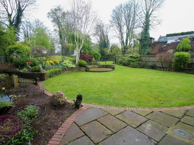 Among the many features in the rear garden are a paved patio and flowerbed borders.