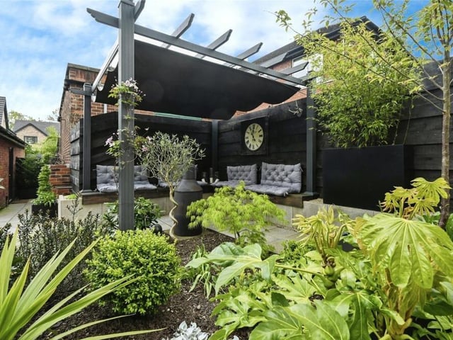 We wrap up our photo gallery with one of the rear garden's highlights, an aluminium pagoda with more seating. Not far away is a brick-built barbecue.