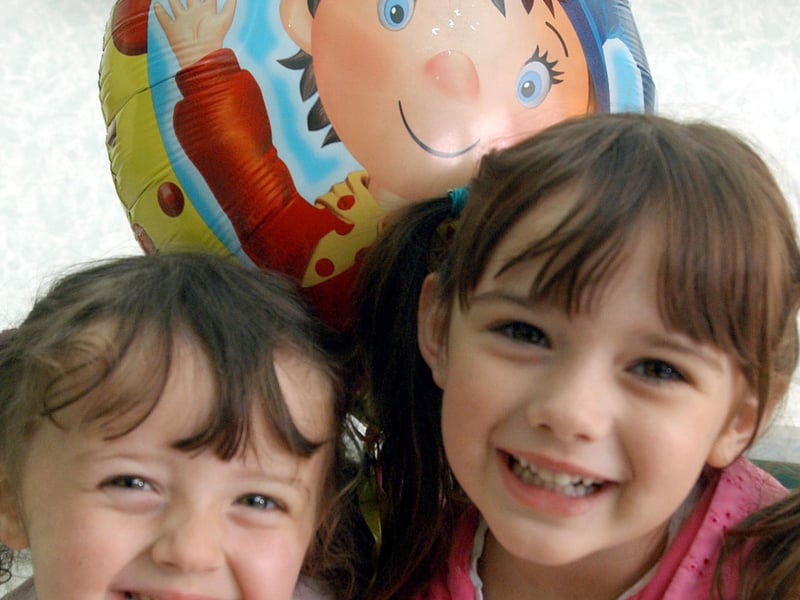 Sisters Sienna and India Salter from Edwinstowe have fun at the balloon stall at Longdale Nursery summer fair.