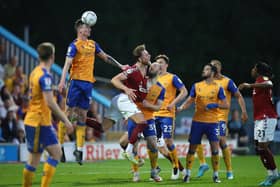Mansfield Town take a 2-1 lead to Northampton Town for Wednesday night's second leg.