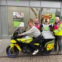 Society mascot, Stanley, with Blood Bike volunteers and their new bike, now named Stanley.