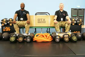 James (left) and Wayne with their haul of new gym equipment