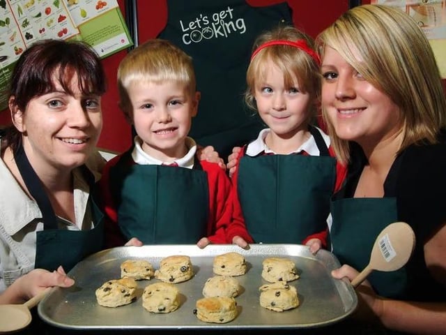 Sharon Granger, Dillon Hayes, Leah Rouse and Sarah Barlow, show off some of the scones they made during a taster session for a cooking club at Selston Infant and Nursery School in January, 2009
