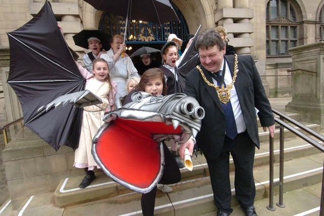 Members of the Steel Valley Beacon Arts Group with 'dragon' Bridget Rudder, deliver tickets for their show to Lord Mayor Coun Alan Law in 2010