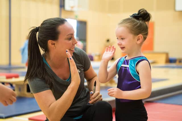 Beth Tweddle and happy pupil - new gymnastics centre for children opening in Mansfield.
